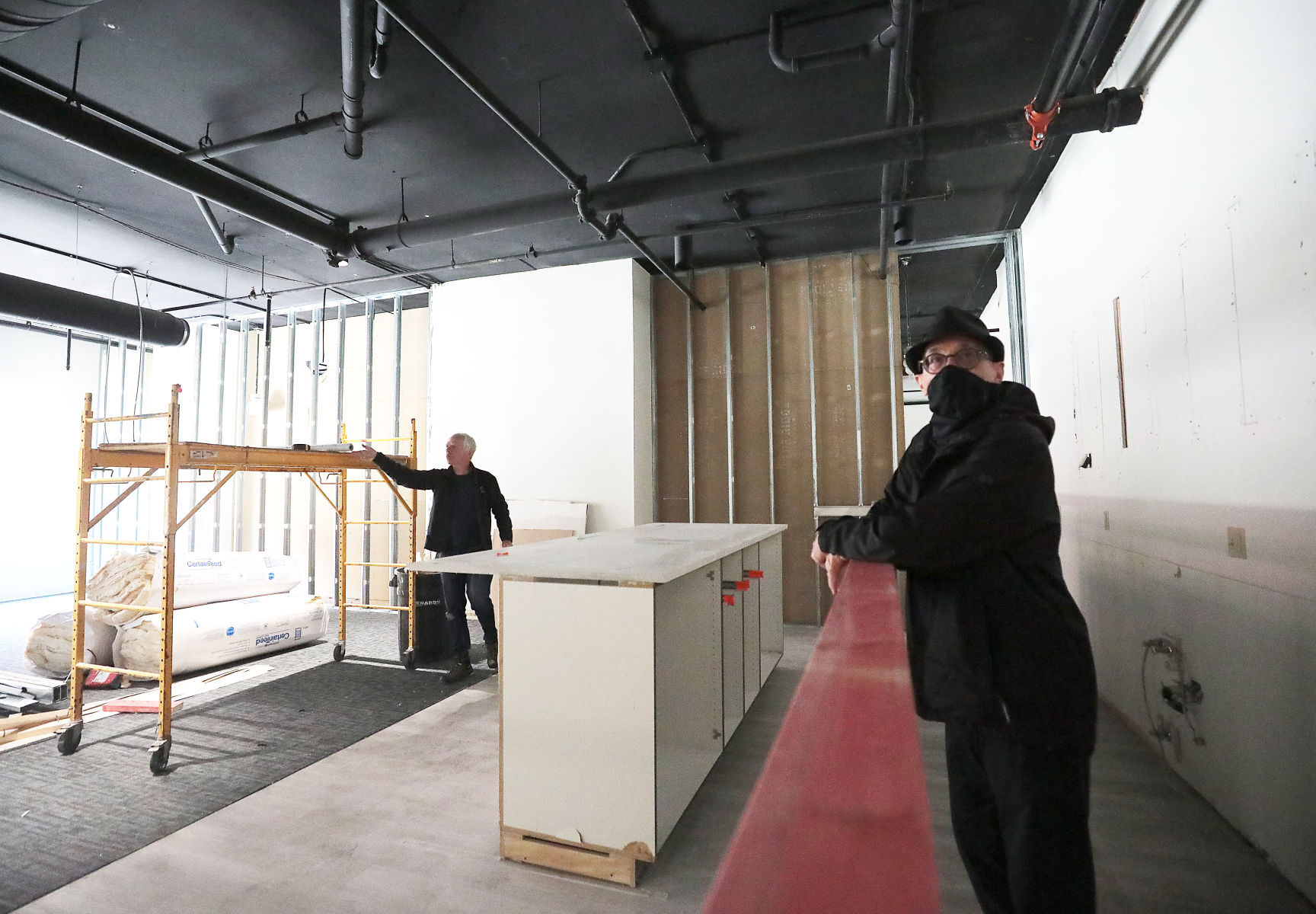 Robert Cleary and Jamie McFadden looking at construction at Kanopy space